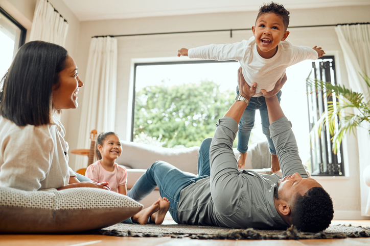 Parents playing with their children