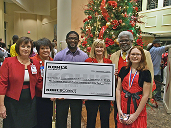 Khols presenting a check to the Safety Zone program