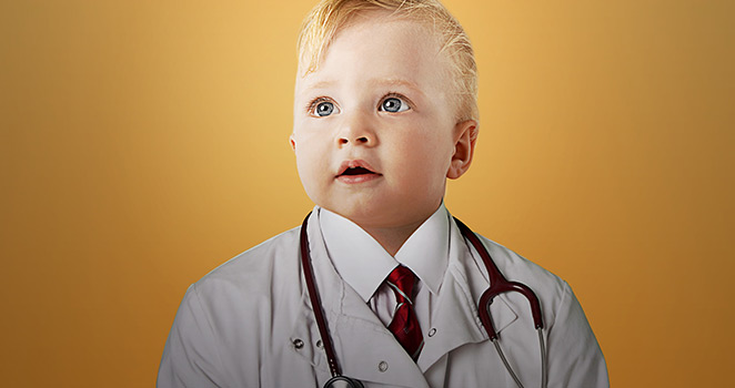 Baby in a doctors coat 