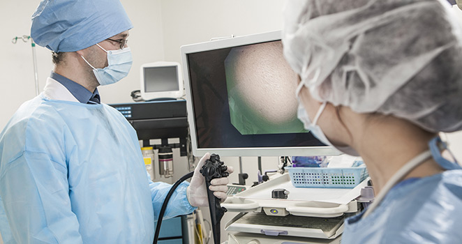 Doctor and nurse look at a computer monitor