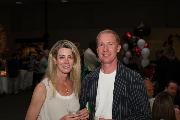 Man and woman standing and smiling at the 25th Silver Anniversary Children's Hospital Golf Classic