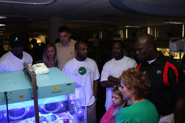 parents get a tour of the fascility and equipment at the 25th Silver Anniversary Children's Hospital Golf Classic