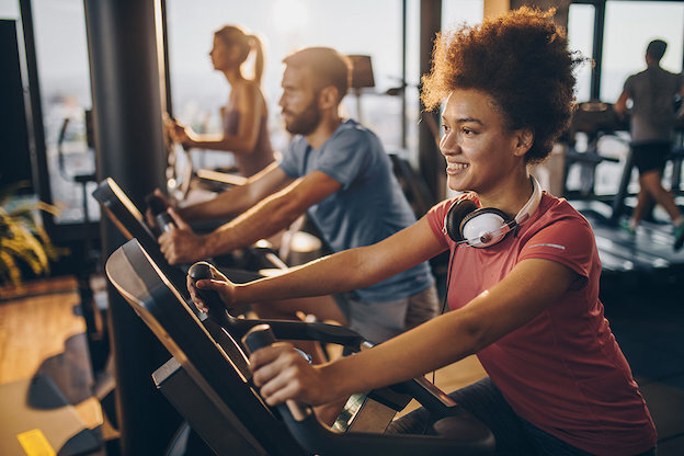 People exercising on stationary bikes.