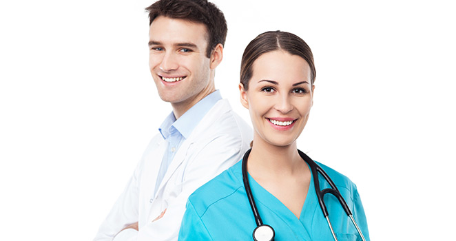 Doctor and nurse standing together smiling