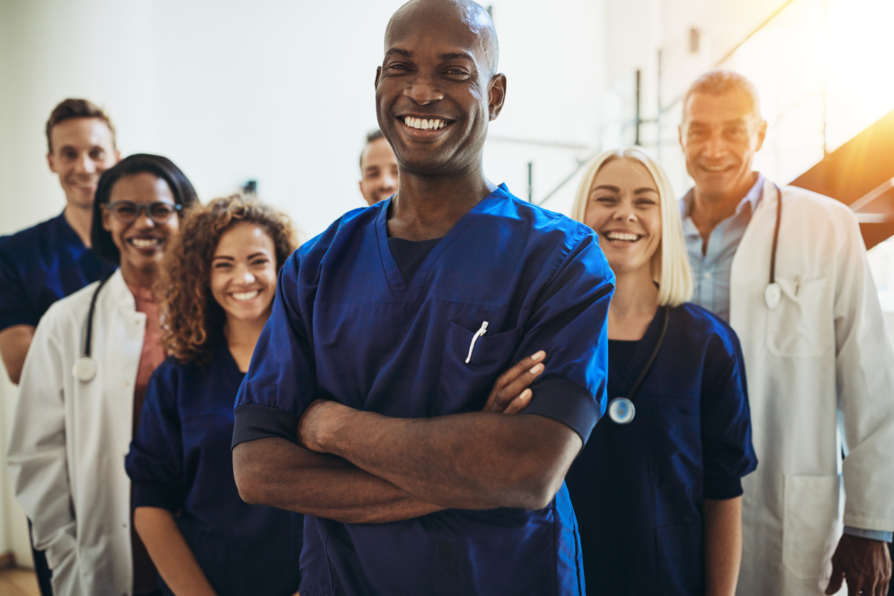 Group of doctors standing together smiling
