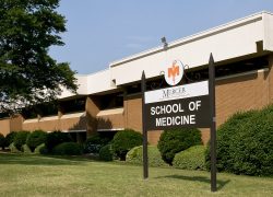 Front of the Mercer School of Medicine building and sign