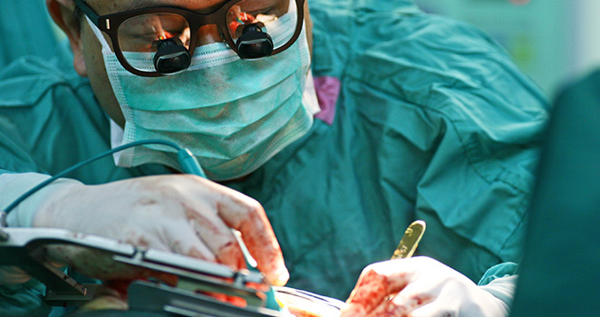 Surgeon performing minimally invasive heart surgery