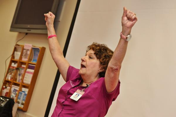 Woman standing in a victory pose