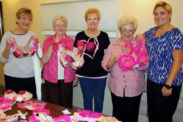 Ladies standing together with their decorated bras