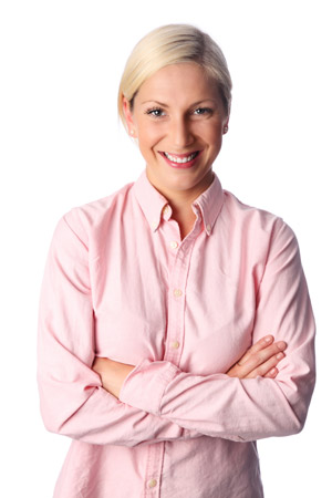 Middle aged woman standing and smiling with her arms crossed