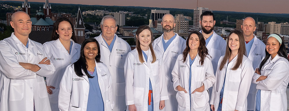 Atrium Health Navicent Musculoskeletal Care Orthopedic Trauma Staff on Roof with Helicopter