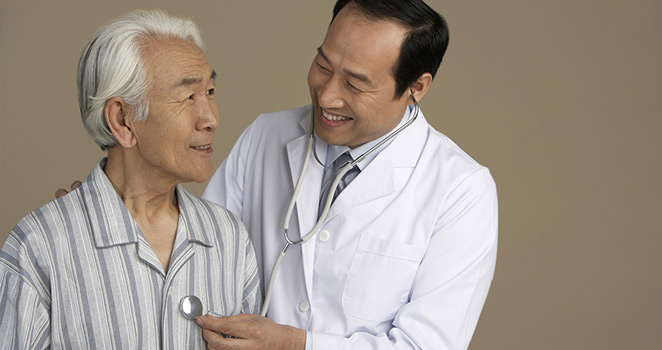 Doctor examinging an elderly male patient